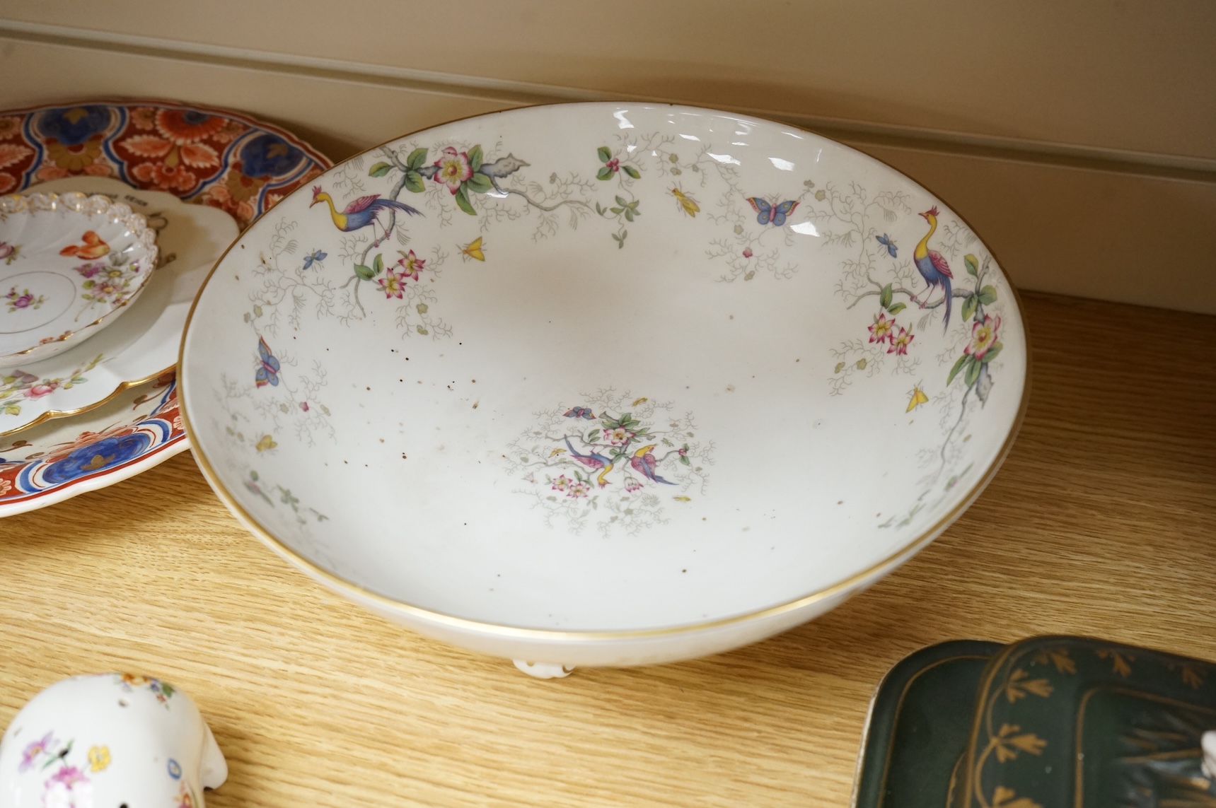 A collection of porcelain and pottery to include commemorative china, a leaf dish and group of wade figures, largest 29cm in diameter